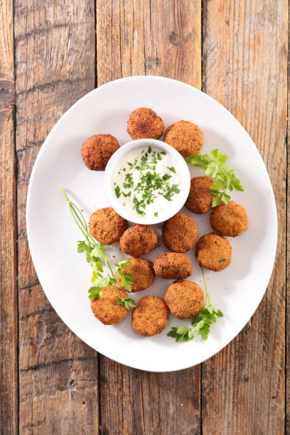 istock falafel with yogurt sauce dip and herbs 1249209298