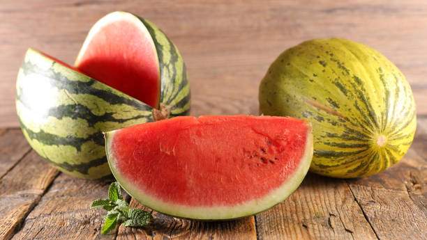 istock watermelon slice on wood background 1249209320