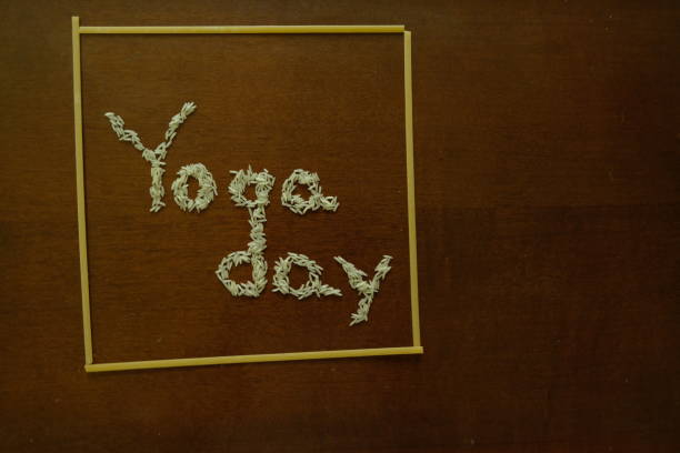 istock Side view of Yoga Day image with rice and spaghetti. 1249209645