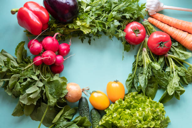 istock Fresh vegetables around on blue background. Healthy concept. Spase for text 1249211196