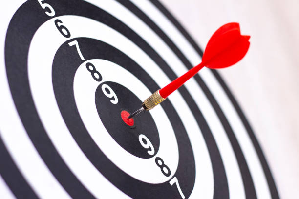 istock Dartboard with hit bullseye on white background, closeup 1249213722