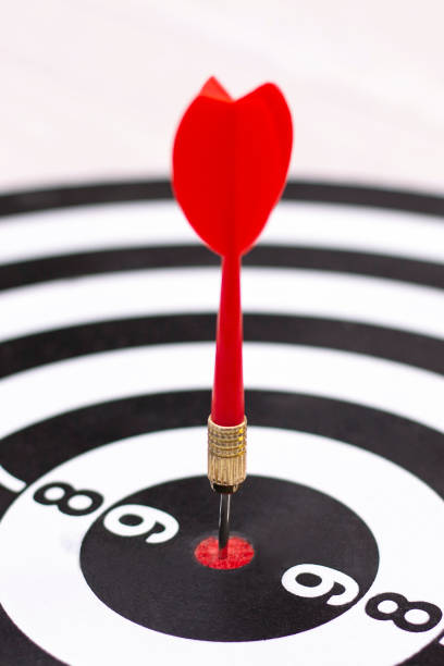 istock Dartboard with hit bullseye on white background, closeup. Bullseye is a business target. Target concept 1249213745