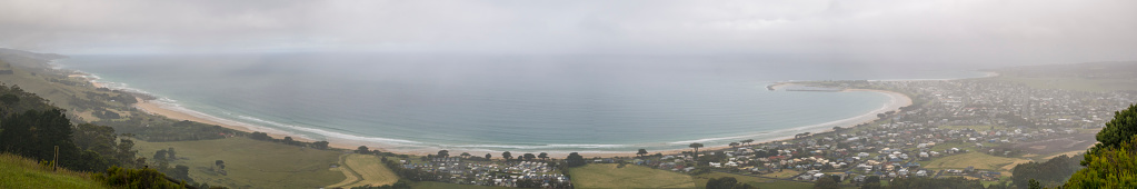 Apollo Bay is town in south-western Victoria, Australia. It is a town along the Great Ocean Road, a popular driving route that winds along the coast. The road goes through rugged coastline, beaches and the mountains of the Otway Ranges.  This photo was taken from the hilltop Marriners Lookout, which offers panoramic views over the town and coastline