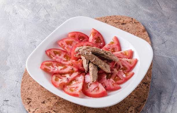 Seasoned tomato with melva ready to eat. Spanish restaurant dish Seasoned tomato with melva ready to eat. Spanish restaurant dish frigate mackerel stock pictures, royalty-free photos & images