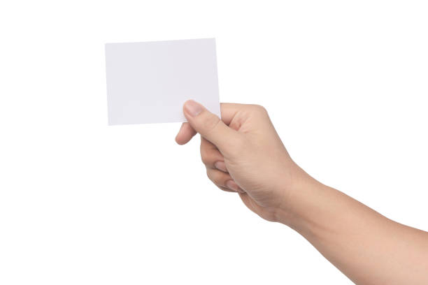 istock Hand holding white paper isolated on white with clipping path 1249219751