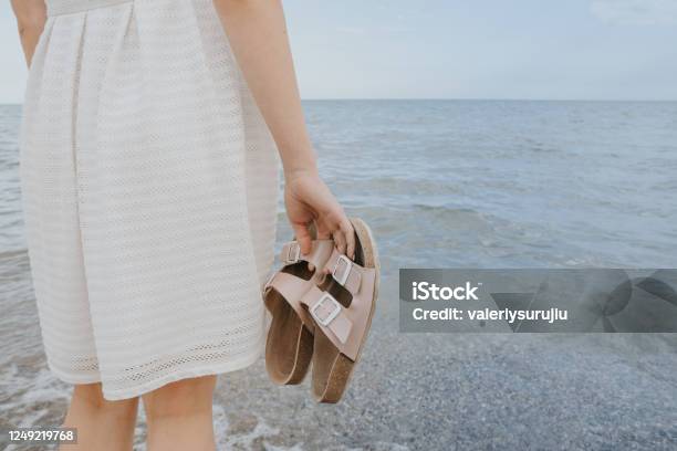 Woman With Beach Slippers Stock Photo - Download Image Now - Women, Summer, Flip-Flop