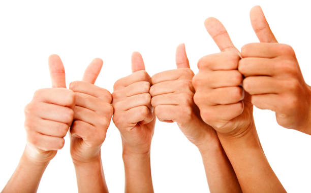 istock Unrecognizable people holding thumbs up 1249220019