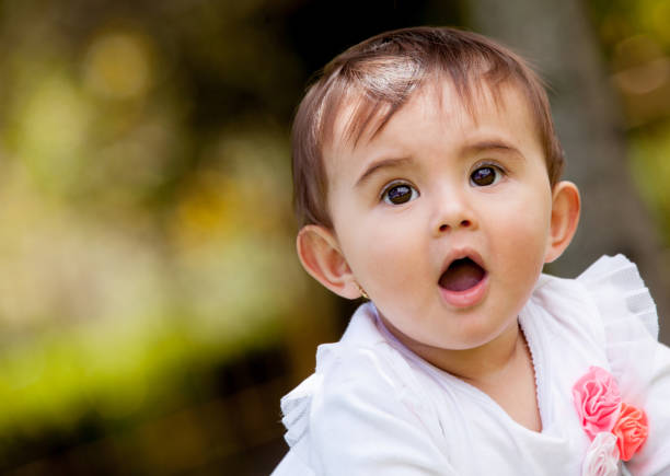 istock Playful baby girl 1249220178