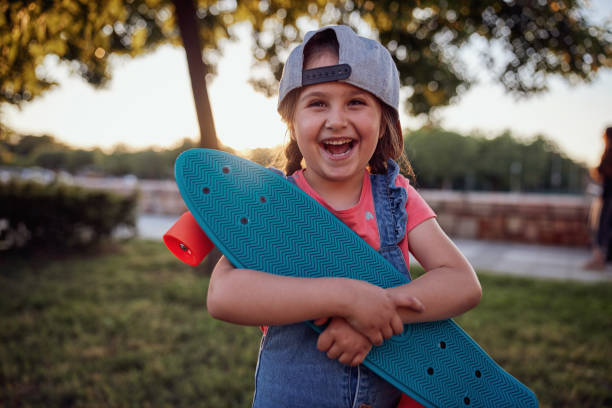 istock Beautiful ecstatic child with a skateboard 1249220772