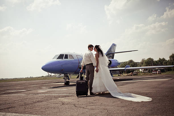 istock Wedding couple fly on honeymoon 124922100
