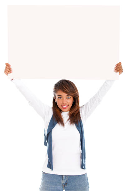 Woman holding a banner with arms up - isolated over white