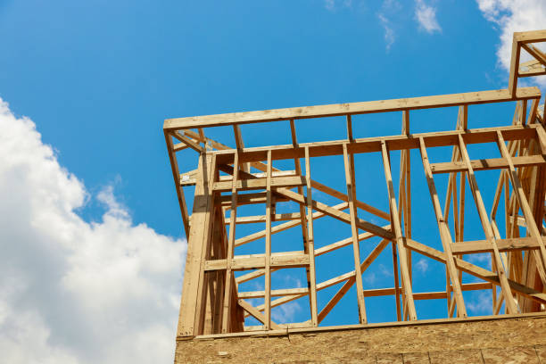 istock New construction home residential construction home framing against a blue sky 1249222869