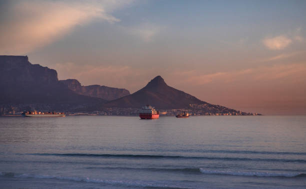 istock Container ships waiting to enter Cape Town harbor. 1249223155