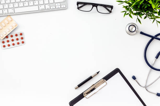 istock Doctor office desk with medicine and tablet. White table top view copy space 1249223266