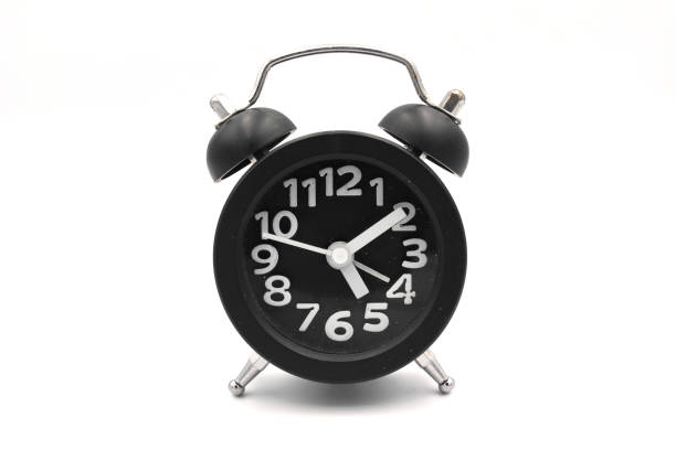 istock Black alarm clock isolated on white 1249227092