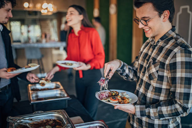 istock Young business people on lunch break together 1249227098