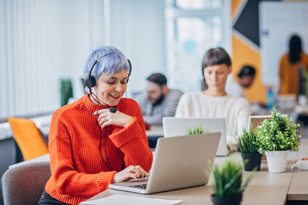 istock Woman working on laptop in big modern office 1249227789