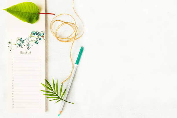 istock Notebook, pencils and plants on the white background, studio shot. Colorful stationery things and accessories. Marketing photos for business and web. 1249229490
