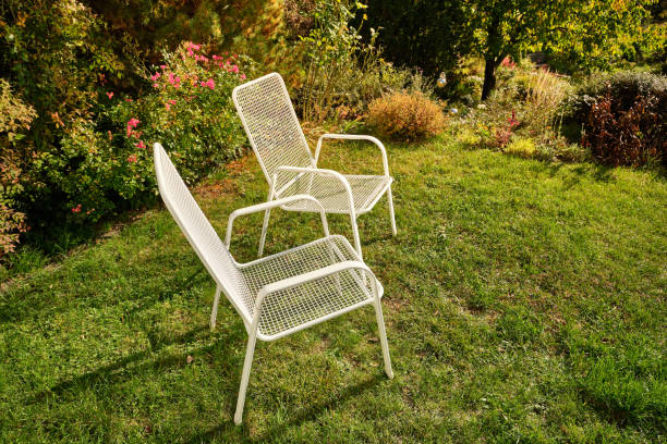 istock White garden chairs in idyllic sunny October garden 1249229507