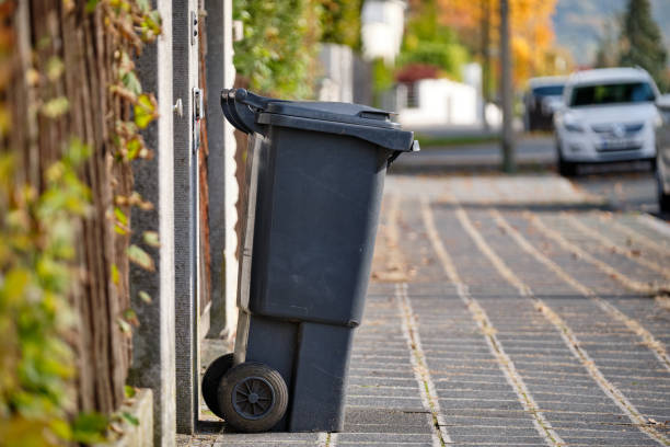 Black garbage bin in a residential areain Germany