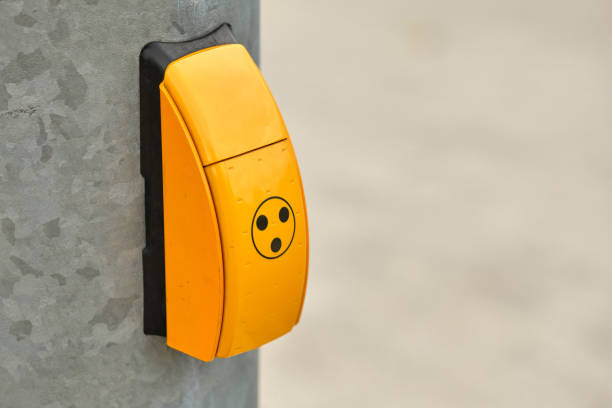 A yellow box at the post of traffic lights in Bavaria, Germany, that singals green for blind and visually impaired persons