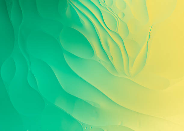 istock Oil and water macro photography abstract green background 1249231868