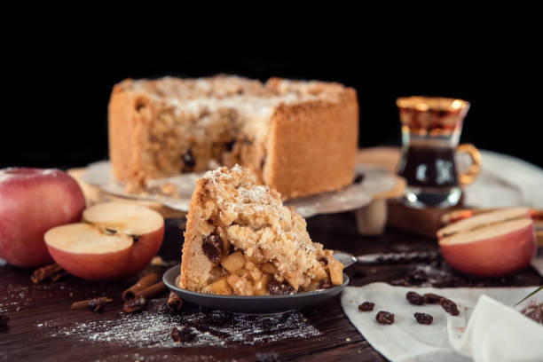 istock Homemade delicious apple pie with different ingredients on rustic background. Classic autumn Thanksgiving dessert - organic apple pie. 1249231940