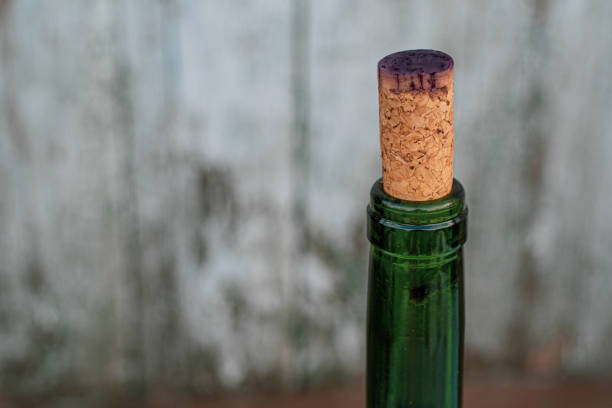 istock Wine bottle top with natural cork stained by purple wine 1249231958