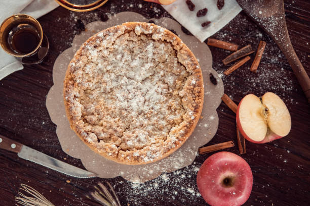 istock Homemade delicious apple pie with different ingredients on rustic background. Classic autumn Thanksgiving dessert - organic apple pie. 1249231989