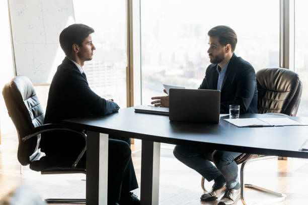 istock Confident hr manager talking to candidate on job interview 1249232509
