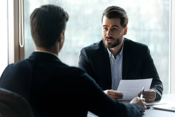 istock Confident hr manager asking questions to candidate on job interview 1249232510