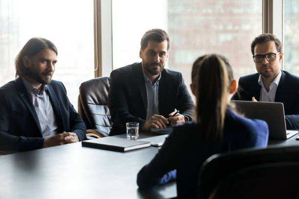 istock Three serious hr managers looking at candidate at meeting 1249232571