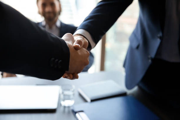 istock Close up employer shaking successful candidate hand at meeting 1249232576