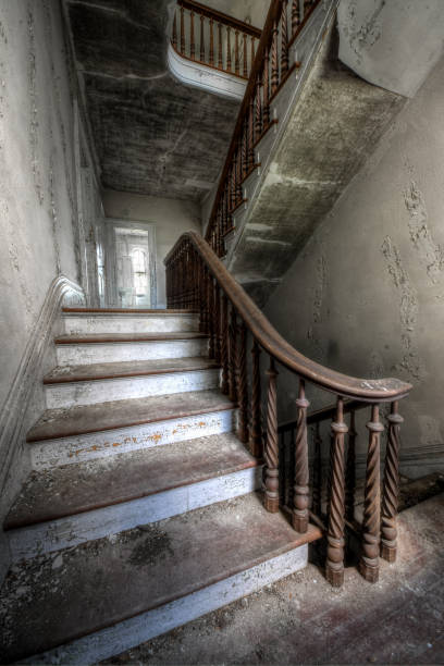 istock Grand staircase in an abandoned mansion 1249238120