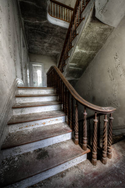 istock Grand staircase in an abandoned mansion 1249238123