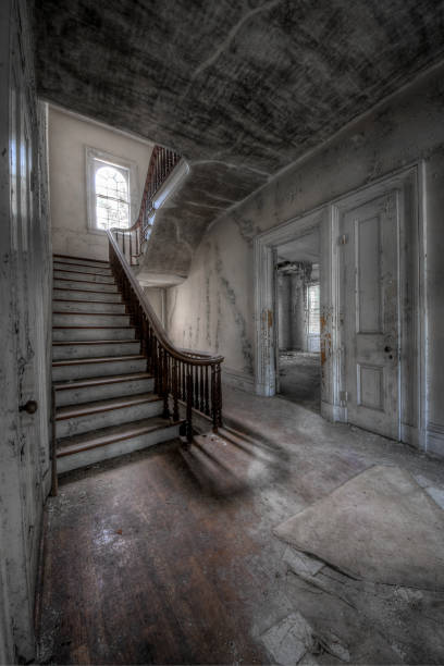 istock Grand staircase in an abandoned mansion 1249238129
