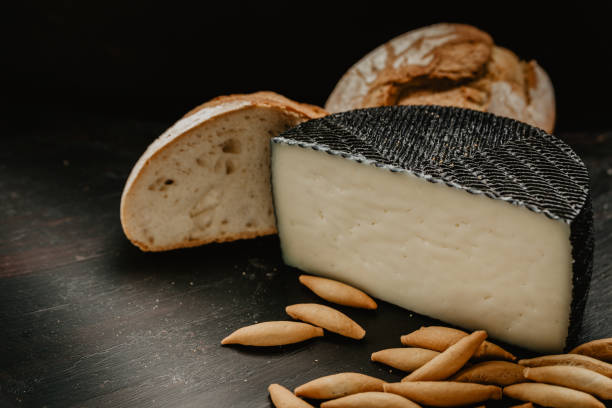 istock cured manchego cheese, with village bread, and breadsticks 1249238363
