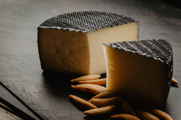 istock cured manchego cheese, with village bread, and breadsticks 1249238365
