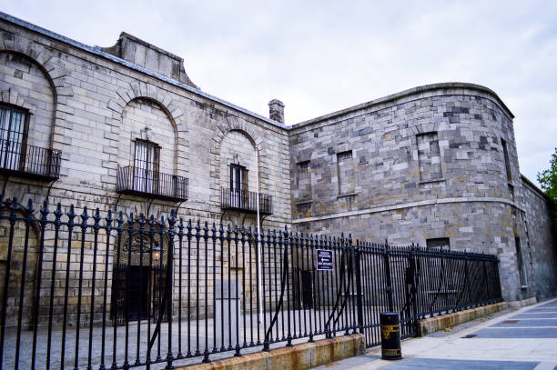 Old Entrance and Stone Wall of Kilmainham Gaol (Prison) in Dublin Ireland stock photo
