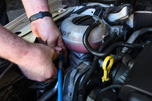 istock refueling the air conditioner in the car 1249245299