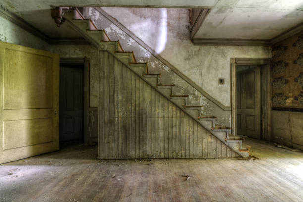 istock Staircase and entry way in Abandoned House interior 1249245396