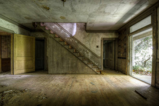 istock Staircase and entry way in Abandoned House interior 1249245410