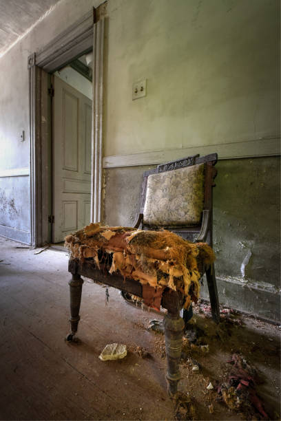 istock Broken chair in an abandoned house 1249245419