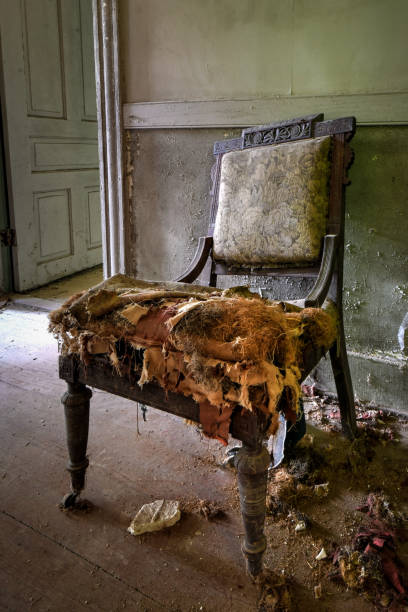 istock Broken chair in an abandoned house 1249245437