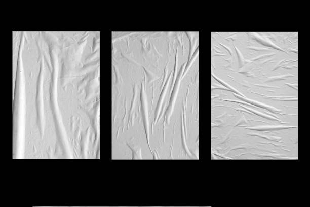 istock Three white crumpled sheets of paper on a black background. 1249246265