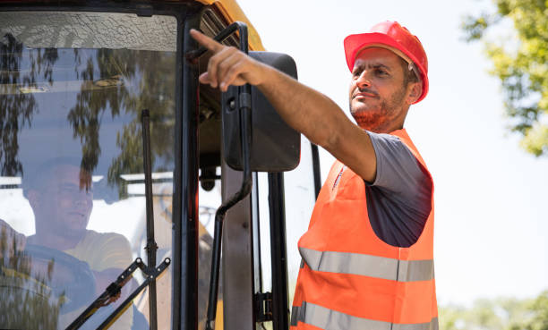 istock Worker driving and pointing his finger 1249249396