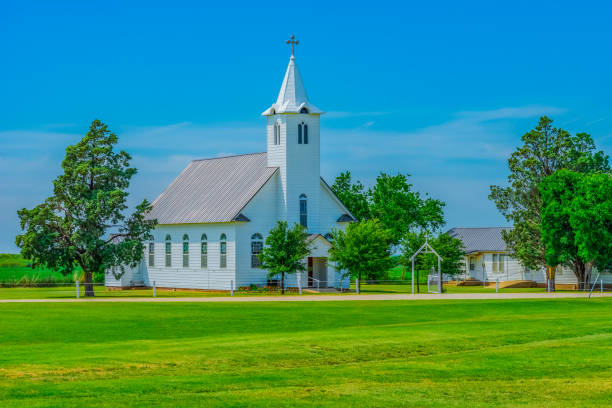 istock An old fashioned white chapel sits in a remote area of Texas. 1249251523