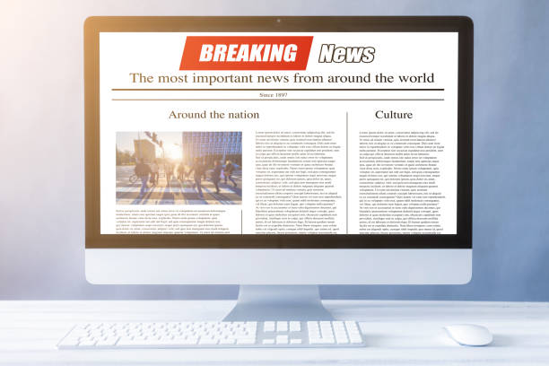 istock news on a computer screen. Mockup website. Newspaper and portal on internet 1249251898