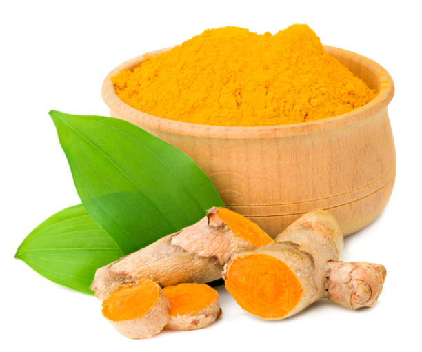 istock Turmeric powder with turmeric root isolated on white background 1249257935