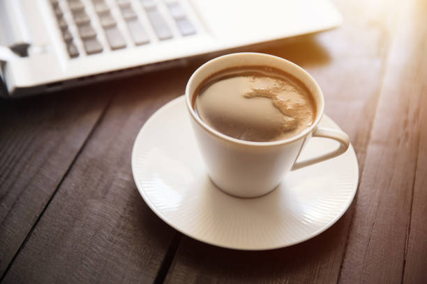 istock cup of coffee and keyboard 1249260840